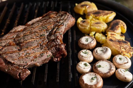 Primerib beef with thyme salt mushrooms on the grill