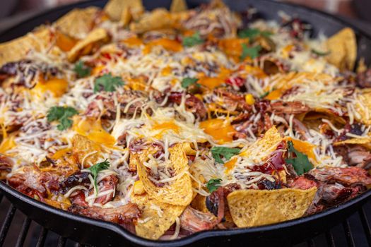 Mexican pulled pork tortilla dish in a huge skillet