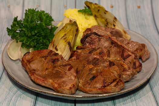 African Lamb chops with chicory and mashed potatoes
