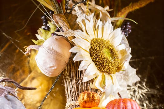 Close up of dried sunflowers against a golden background