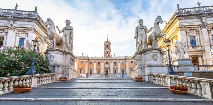 ROME, ITALY - CIRCA AUGUST 2020: staircase to Capitolium Square (Piazza del Campidoglio). Made by Michelangelo, it is home of Rome (Roma) City Hall. Sunrise light, before turist arrival.