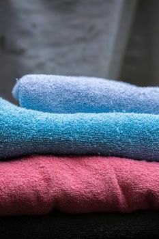 Close up of folded blue and pink towels