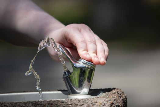 Water from an outdoor water fountain spurting up