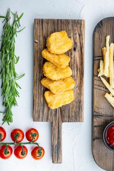 Chicken nuggets fried on white background, flat lay.