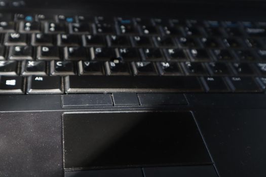 Black laptop keyboard close up