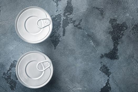 Canned sauce tin can, on gray background, top view or flat lay with copy space for text