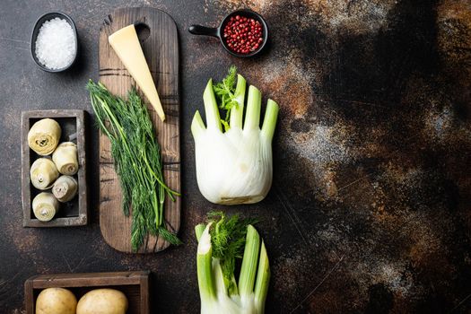 Fennel and artichoke with parmesan raw ingredient, on old rustic background, flat lay with space for text