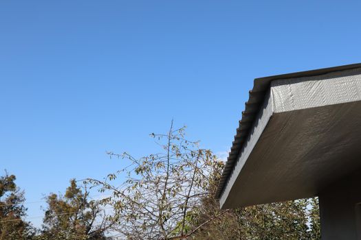 The canopy on the porch is covered with slate