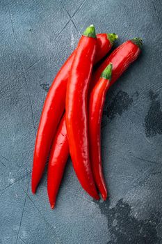 Raw red chili pepper set, on grey background, flat lay