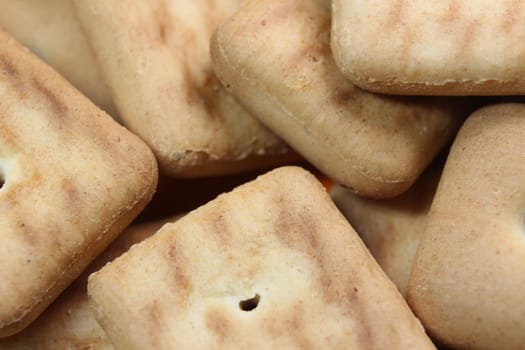 Close up top view of of biscuit cookies. Close up view rectangular biscuits with small pores