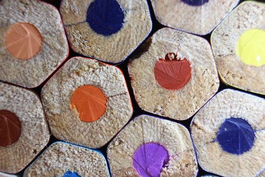 Multicolored pencils bottom macro view closeup background, education, student and school concept, wooden colorful pencil texture