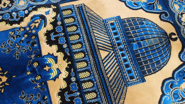 Closeup view of prayer rug in place to make prayer. High angle view of lovely prayer mat or prayer rug for Muslims