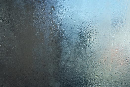 Bright grey color glassy texture, with water drops on it: abstract background