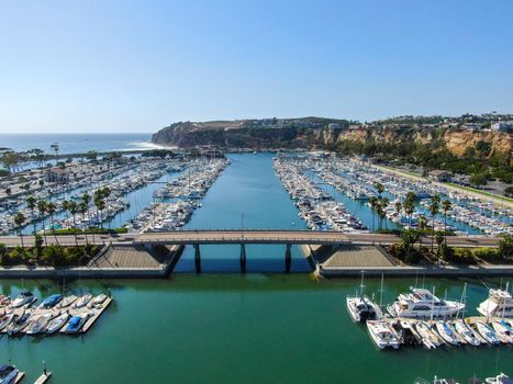 Aerial view of Dana Point Harbor and her marina with yacht and sailboat. southern Orange County, California. USA