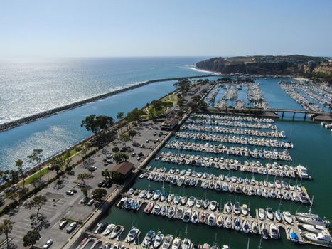 Aerial view of Dana Point Harbor and her marina with yacht and sailboat. southern Orange County, California. USA