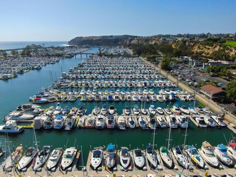 Aerial view of Dana Point Harbor and her marina with yacht and sailboat. southern Orange County, California. USA