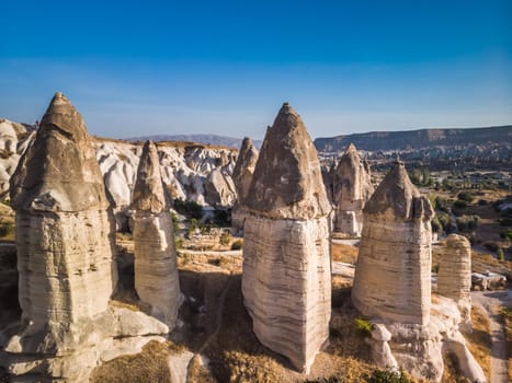 Aerial drone view of the fairy chimney landscape in Love Valley of Cappadocia in Goreme, Turkey.