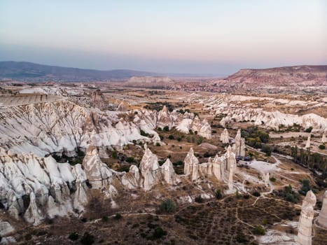 Aerial drone view of the fairy chimney landscape in Love Valley of Cappadocia in Goreme, Turkey.