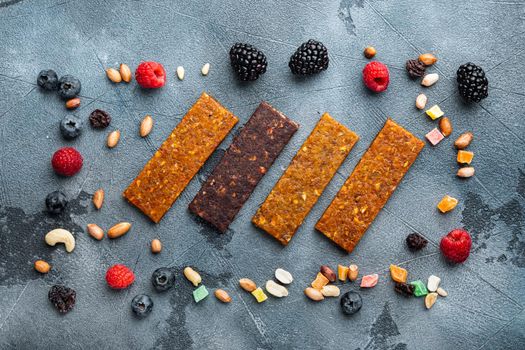 Dried fruits energy bars, flat lay, on grey background
