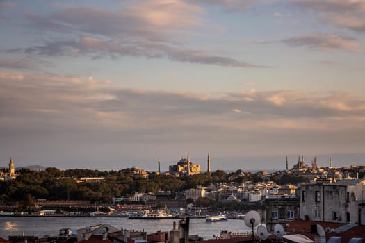 Istanbul sunset skyline panoramic view of Istanbul Turkey. Beautiful Bosphorus with mosques at the background.