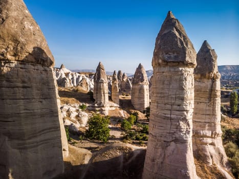 Aerial drone view of the fairy chimney landscape in Love Valley of Cappadocia in Goreme, Turkey.