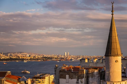 Istanbul sunset skyline panoramic view of Istanbul Turkey. Beautiful Bosphorus with mosques at the background.