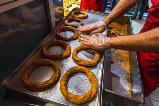 In Turkey the locals prefer hand-made bread, each family buying at least 5 breads each day. Image of a baker in a traditional Turkish bakery in Istanbul, Turkey.