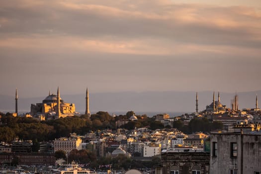 Istanbul sunset skyline panoramic view of Istanbul Turkey. Beautiful Bosphorus with mosques at the background.