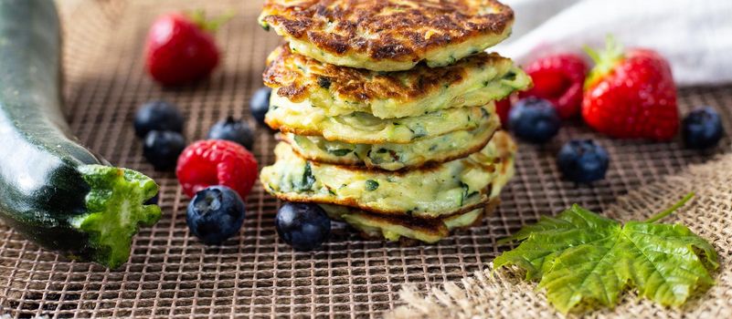 Healthy summer breakfast with courgette pancakes, strategies fruits maple syrup. Healthy testy summer breakfast