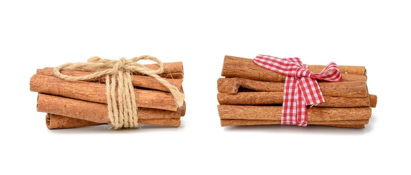 dry cinnamon sticks tied with red ribbon, spice isolated on white background, set