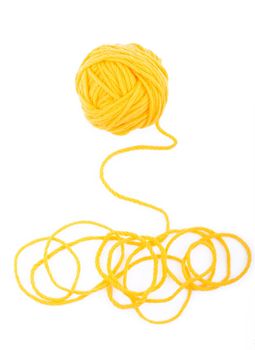 The idea is a tangled thread. Yellow ball of yarn on white background