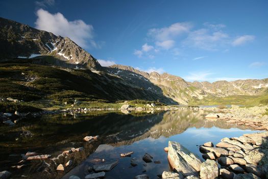 Pond in a valley in the Carpathian Mountains at dawn