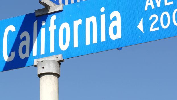 California street road sign on crossroad. Lettering on intersection signpost, symbol of summertime travel and vacations. USA tourist destination. Text on nameboard in city near Los Angeles, route 101.