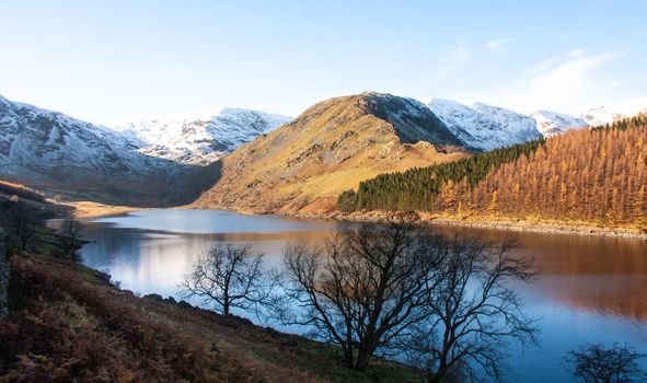 Winter mountain landscape. Lake District UK. Winter lake with mountain