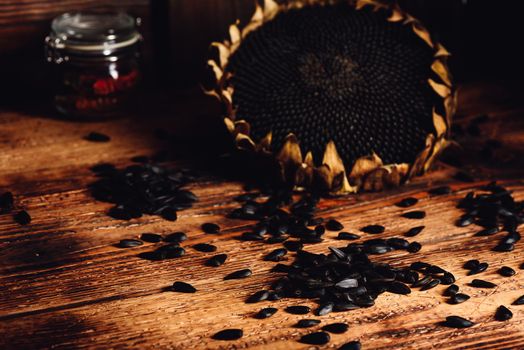 Dried sunflower and roasted seeds on the old wooden table