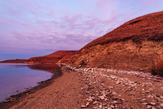 Autumn sunrise on the hilly coast of Zay river