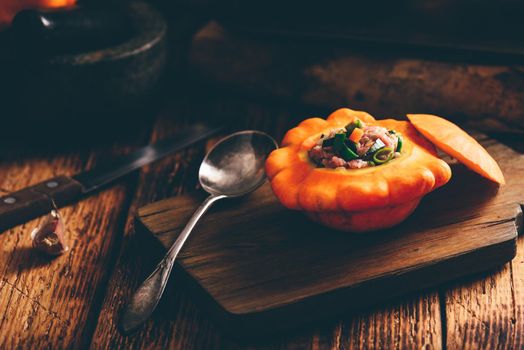 Raw pattypan squash stuffed with minced meat and vegetables