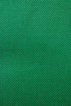 Dark green rough textile material. background texture close-up.