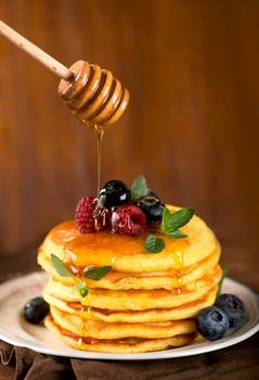 Stack of pancakes with fresh berries, close-up