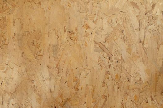 Yellow patterned plywood texture close up with blurred part of frame.Texture or background