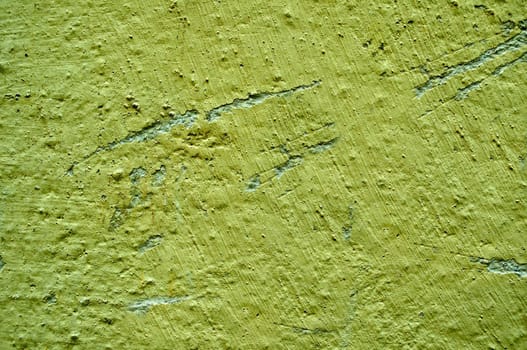 The old wall surface is green with irregularities and roughness.Texture or background