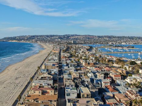 Aerial view of Mission Bay and Beaches in San Diego, California. USA. Community built on a sandbar with villas, sea port and recreational Mission Bay Park. Californian beach lifestyle.