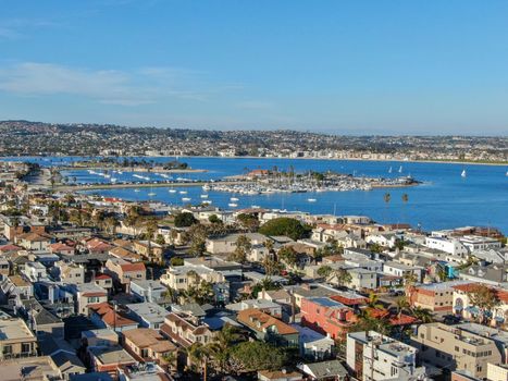 Aerial view of Mission Bay and Beaches in San Diego, California. USA. Community built on a sandbar with villas, sea port and recreational Mission Bay Park. Californian beach lifestyle.