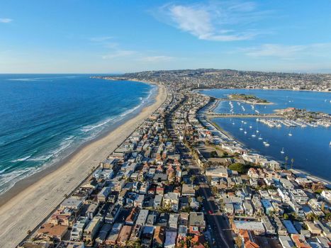 Aerial view of Mission Bay and Beaches in San Diego, California. USA. Community built on a sandbar with villas, sea port and recreational Mission Bay Park. Californian beach lifestyle.