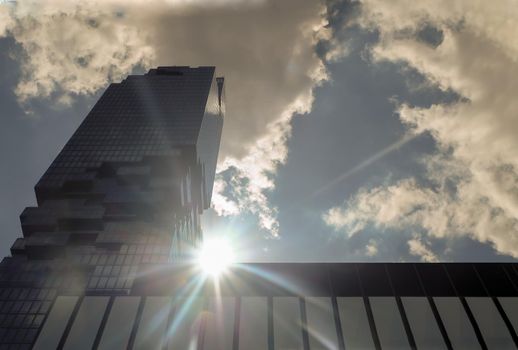 Bangkok, Thailand - July 10, 2019: The sun's rays passing through at The King Power Mahanakhon skyscraper. The tallest building in Thailand. No focus, specifically.