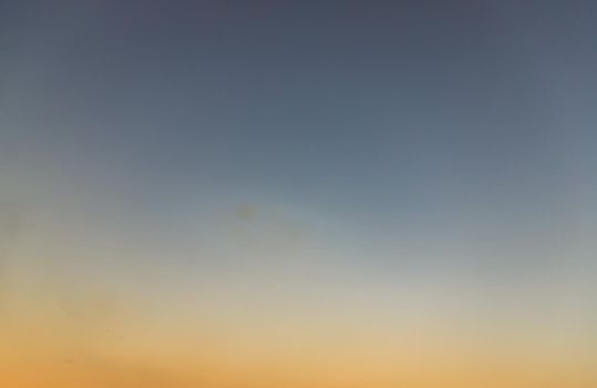 Background of blue and orange sky and empty space for your design. No cloud, No focus, specifically.