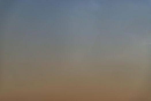 Background of blue and orange sky and empty space for your design. No cloud, No focus, specifically.