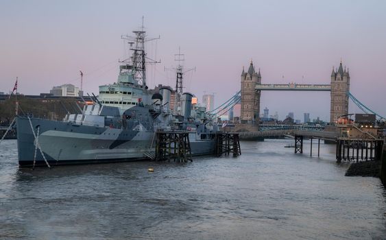 London, England - Apr 20, 2019 : HMS Belfast is a Town-class light cruiser that was built for the Royal Navy. She is now permanently moored as a museum ship in front of Tower Bridge on the River Thames, No focus, specifically.
