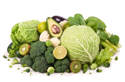 Group of green vegetables and fruits on white background