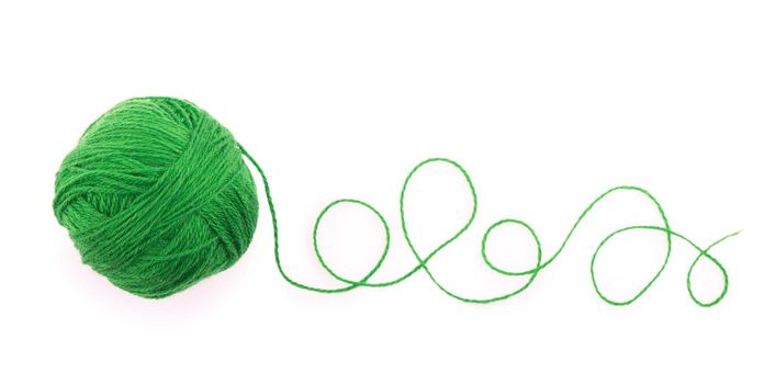 The idea is a tangled thread. Green ball of yarn on white background